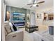 The living room features comfortable seating, a modern fireplace, and an open layout to the kitchen at 1502 Fern Bay Ct, Orlando, FL 32824