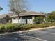 View of the poolside cabana with shaded area and accessible parking nearby at 1502 Fern Bay Ct, Orlando, FL 32824