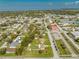 Wide aerial shot of a residence in a leafy, sprawling neighborhood, emphasizing community and a tranquil lifestyle at 1518 Mississippi Ave, St Cloud, FL 34769