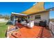 Spacious brick patio with fire pit, seating, and barbecue, excellent for backyard gatherings and relaxation at 1518 Mississippi Ave, St Cloud, FL 34769