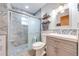 Updated bathroom with a glass-enclosed shower and stylish vanity at 1518 Mississippi Ave, St Cloud, FL 34769