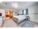 The main bedroom boasts neutral walls, wood-style flooring, and access to the ensuite bathroom at 1518 Mississippi Ave, St Cloud, FL 34769