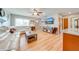 Cozy living room features hardwood floors, a ceiling fan, and lots of natural light at 1518 Mississippi Ave, St Cloud, FL 34769