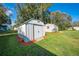 Outdoor storage shed in a well-maintained yard, offering functional space for gardening and tools at 1518 Mississippi Ave, St Cloud, FL 34769