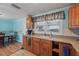 Charming kitchen showcasing ample counter space, wood cabinets, and a window view at 1622 Marlin St, St Cloud, FL 34771
