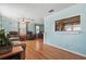 Bright living room featuring beautiful wood floors, comfortable seating, and an open layout at 1622 Marlin St, St Cloud, FL 34771