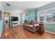 Comfortable living room showcasing hardwood floors, cozy seating, and a relaxing atmosphere at 1622 Marlin St, St Cloud, FL 34771