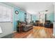 Cozy living room with comfortable seating, hardwood floors, and ample natural light at 1622 Marlin St, St Cloud, FL 34771