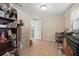 Office space featuring tile flooring, storage shelves, and ample light at 1622 Marlin St, St Cloud, FL 34771