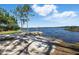 Scenic lake view with a boat ramp and clear blue sky, enhancing the appeal of waterfront living at 1622 Marlin St, St Cloud, FL 34771