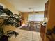 Bright dining area with tiled flooring, complemented by a glass-top dining table at 205 Elinor S Ave, Dundee, FL 33838