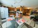 Eat-in kitchen with wooden cabinets and an adjacent dining area at 205 Elinor S Ave, Dundee, FL 33838