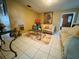 Cozy living room with a plush sofa and tiled flooring at 205 Elinor S Ave, Dundee, FL 33838