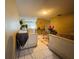 Bright living room boasts neutral paint, tiled floors, and direct access to dining area at 205 Elinor S Ave, Dundee, FL 33838