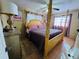 Bedroom featuring a four-poster bed, ceiling fan, and natural light from a window at 205 Elinor S Ave, Dundee, FL 33838