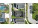 A bird's eye view shows a backyard oasis with a pool and meticulously landscaped yard at 205 Norfolk Pl, Celebration, FL 34747