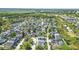 Aerial view of a residential neighborhood showing the property outlined in white at 205 Norfolk Pl, Celebration, FL 34747