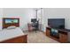Small bedroom with neutral carpet, desk, and dark wood furniture at 205 Norfolk Pl, Celebration, FL 34747