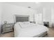 Comfortable bedroom with a tufted headboard and matching nightstands at 205 Norfolk Pl, Celebration, FL 34747