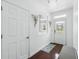 Hallway with hardwood floors, neutral walls, and decorative mirror at 205 Norfolk Pl, Celebration, FL 34747