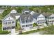 Charming two-story home with a welcoming front porch and white picket fence at 205 Norfolk Pl, Celebration, FL 34747