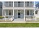 Inviting front porch featuring a charming entrance and well-maintained landscaping, creating a warm and welcoming atmosphere at 205 Norfolk Pl, Celebration, FL 34747