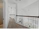 Hallway showcasing carpet, white wall paint and dark brown accents at 205 Norfolk Pl, Celebration, FL 34747
