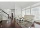 Well-lit living room with hardwood floors, neutral walls, and bright lighting at 205 Norfolk Pl, Celebration, FL 34747