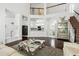 Spacious living room with view of kitchen and bright workspaces at 205 Norfolk Pl, Celebration, FL 34747