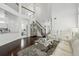 Open-concept living room with modern furniture, high ceilings, and hardwood floors at 205 Norfolk Pl, Celebration, FL 34747