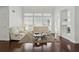Bright living room featuring white sofas, a modern coffee table, and large windows at 205 Norfolk Pl, Celebration, FL 34747