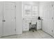 Bright office nook featuring marble countertops, and white cabinets offering workspace and storage at 205 Norfolk Pl, Celebration, FL 34747