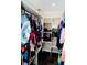 Walk-in closet with ample storage space and organized shelving, perfect for wardrobe management at 2224 Paria Ln, Kissimmee, FL 34758