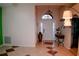 Open foyer with high ceilings, tile flooring, an arched transom window and an inviting entryway at 2224 Paria Ln, Kissimmee, FL 34758
