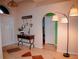 Welcoming foyer with decorative table, lamps and artwork at 2224 Paria Ln, Kissimmee, FL 34758