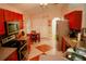 Spacious kitchen with stainless steel appliances, dining table, and ample cabinet space at 2224 Paria Ln, Kissimmee, FL 34758