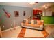 A cozy living room with decorative guitars on the wall, a comfortable sofa and unique tile flooring at 2224 Paria Ln, Kissimmee, FL 34758