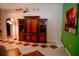 Spacious living room featuring tile floors, ample natural light, and a unique decorative display at 2224 Paria Ln, Kissimmee, FL 34758