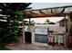 Outdoor kitchen has a stainless steel grill and stone backsplash, plus sink and prep area, for outdoor dining at 2224 Paria Ln, Kissimmee, FL 34758