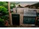 This outdoor kitchen has a stainless steel grill, a tap, and stone backsplash for fun outdoor grilling and dining at 2224 Paria Ln, Kissimmee, FL 34758