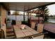 Outdoor patio features a gas grill and a built-in outdoor kitchen with a table and seating at 2224 Paria Ln, Kissimmee, FL 34758