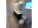 Modern bathroom featuring a dual sink vanity with a quartz countertop at 231 Villa Domani Cir # 59, Davenport, FL 33896