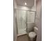 Contemporary bathroom featuring a glass-enclosed shower and modern fixtures at 231 Villa Domani Cir # 59, Davenport, FL 33896