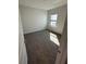 Clean, well-lit bedroom with a window, neutral carpet, and fresh paint at 231 Villa Domani Cir # 59, Davenport, FL 33896