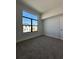Sunlit bedroom featuring a large window with views of the neighborhood at 231 Villa Domani Cir # 59, Davenport, FL 33896