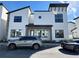 Contemporary townhouse showcasing a minimalist design, neutral colors, and ample parking spaces at 231 Villa Domani Cir # 59, Davenport, FL 33896