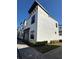 Newly constructed townhome featuring sleek lines, dark trim, and contemporary design elements at 231 Villa Domani Cir # 59, Davenport, FL 33896