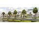 Charming row of townhouses featuring modern architecture and lush landscaping in a desirable community at 231 Villa Domani Cir # 59, Davenport, FL 33896