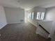 Cozy carpeted loft space with natural light from multiple windows at 231 Villa Domani Cir # 59, Davenport, FL 33896