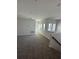 Spacious carpeted loft features ample lighting and bright neutral walls at 231 Villa Domani Cir # 59, Davenport, FL 33896